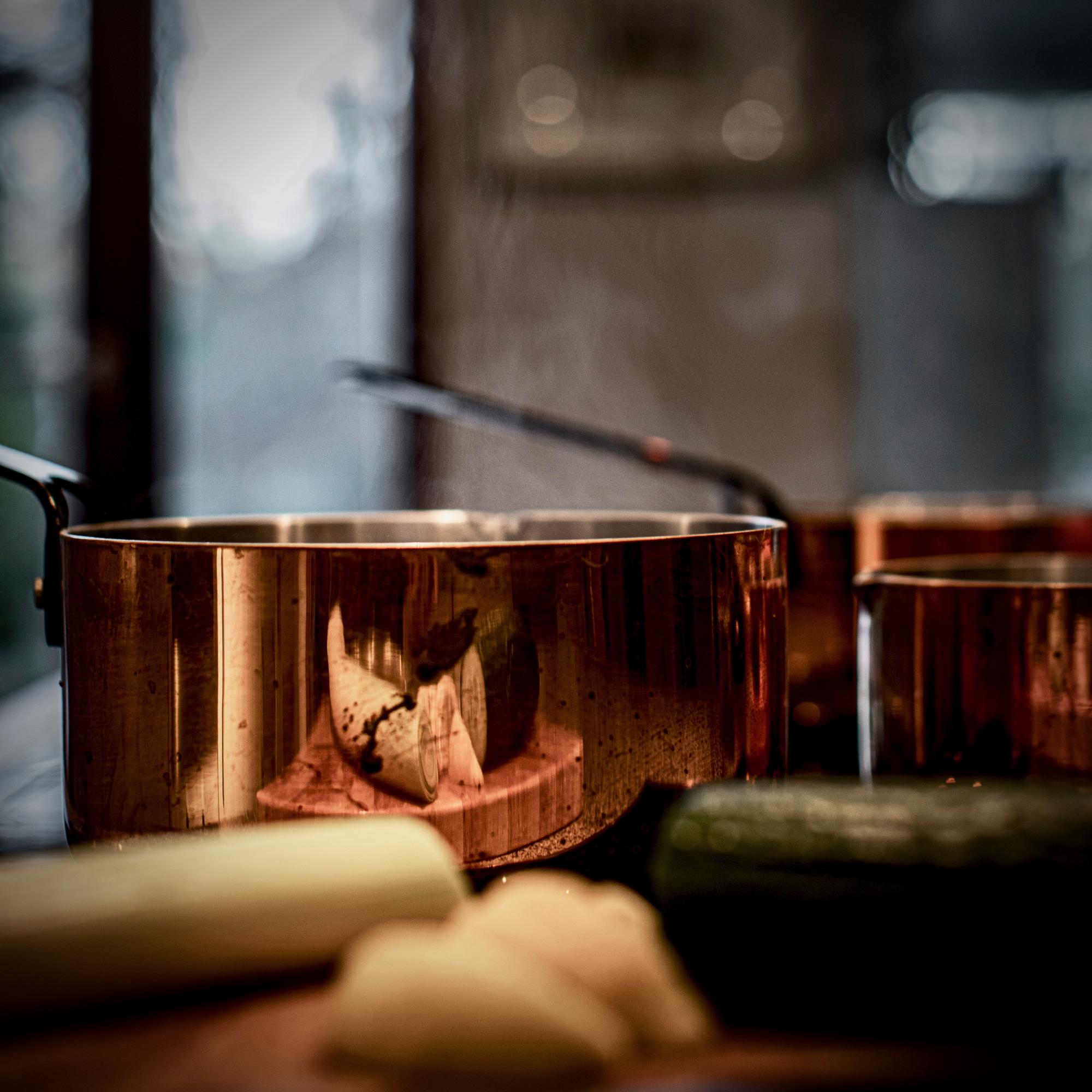 Workshop kitchen with copper pans and utensils